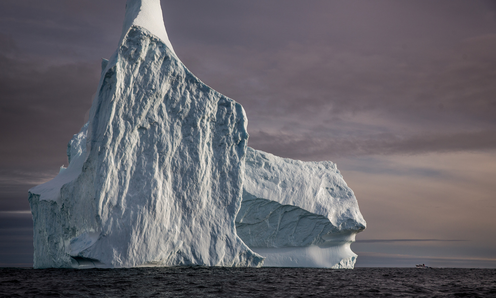 A_huge_iceberg_and_a_tiny_boat_near_Tasiilaq_in_East_Greenland_slider_1750930725.jpg